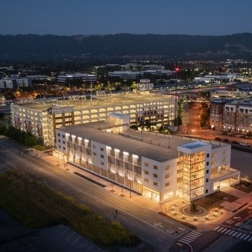 Exterior, nighttime view of the parking structure