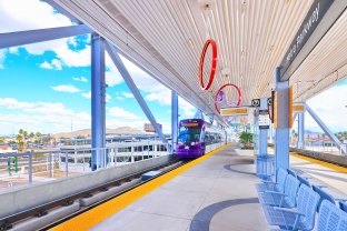 View of a train coming into the light rail station.