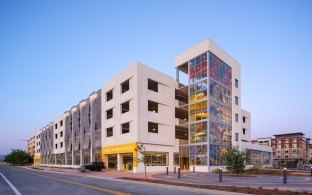 Exterior view of the parking structure in the daytime.