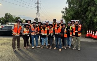 Group of people gathering at a jobsite.