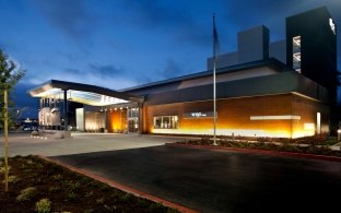 Exterior view of the hotel at nighttime.
