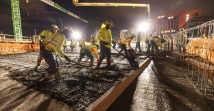 Group of people working on a concrete pour