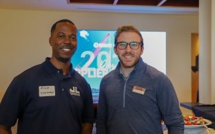 Two people standing during Supplier Diversity Day.