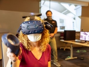 Person using virtual reality headset.