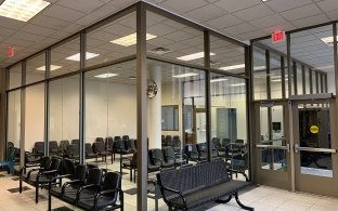 A waiting area with chairs and benches.