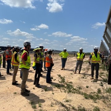 A group of interns on a renewable energy jobsite tour.