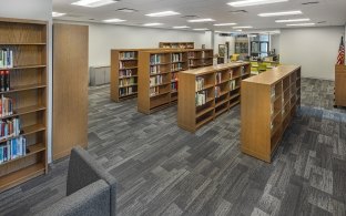A library with bookshelves filled with books.