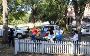 Group of people cleaning up the community at a volunteer event.