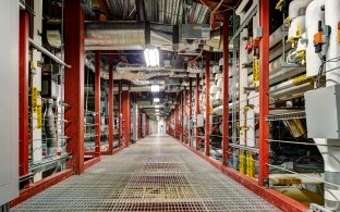 A complex electrical and HVAC room in a research laboratory.