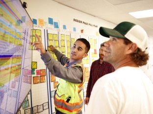 People working on plan together.
