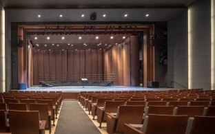 The interior of Kinder High School's auditorium.