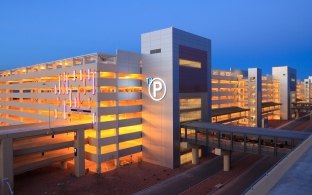 Exterior view of the parking garage at night.