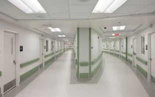 Indoor image of two hallways with patient rooms