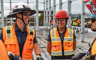 A group of people talking at a jobsite.