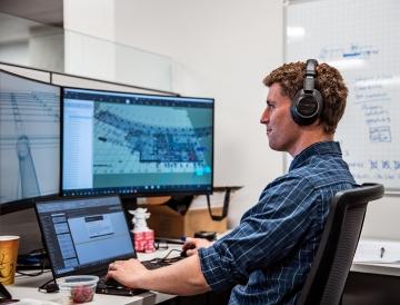 Person working at computer.