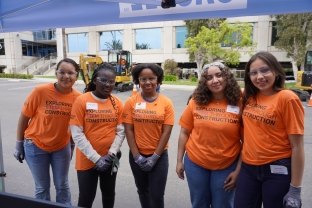 Group of people posing at McCarthy's Exploring STEM Through Construction Event.